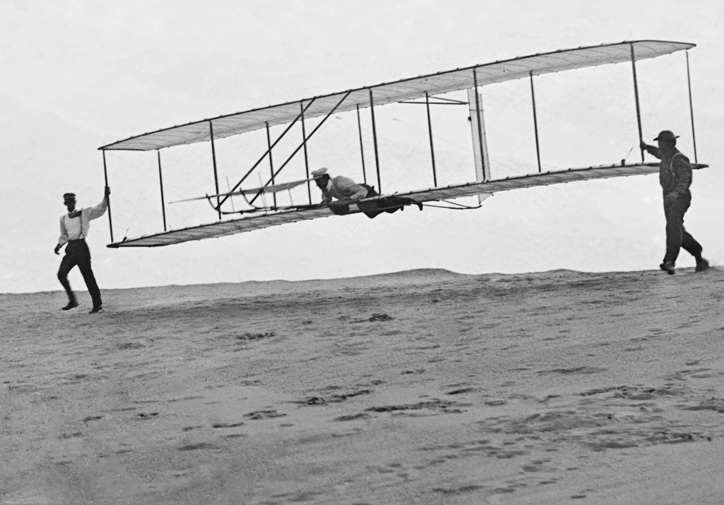 Wilbur Wright at the controls of a glider