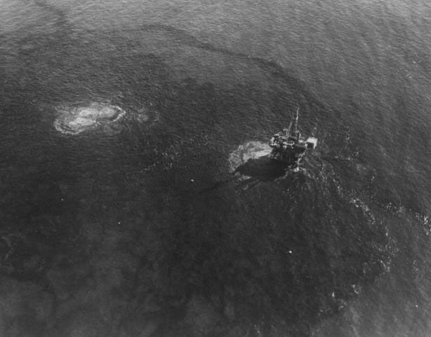 oil-blackened beach and water from the 1969 santa barbara oil spill