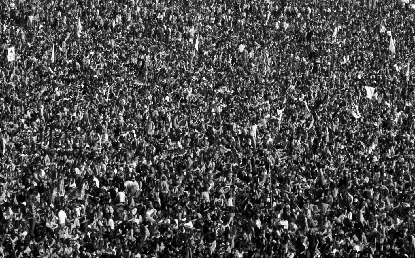 rolling stones crowd at knebworth house in 1976, black and white photograph