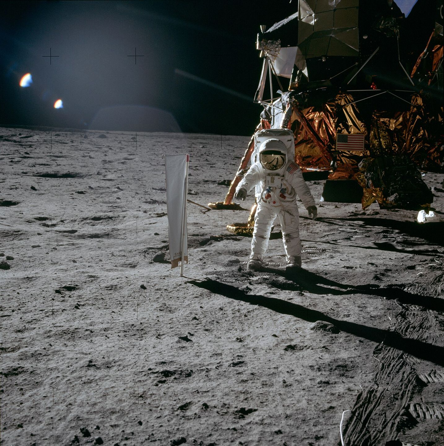 buzz aldrin deploying the solar wind composition experiment on the moon during apollo 11