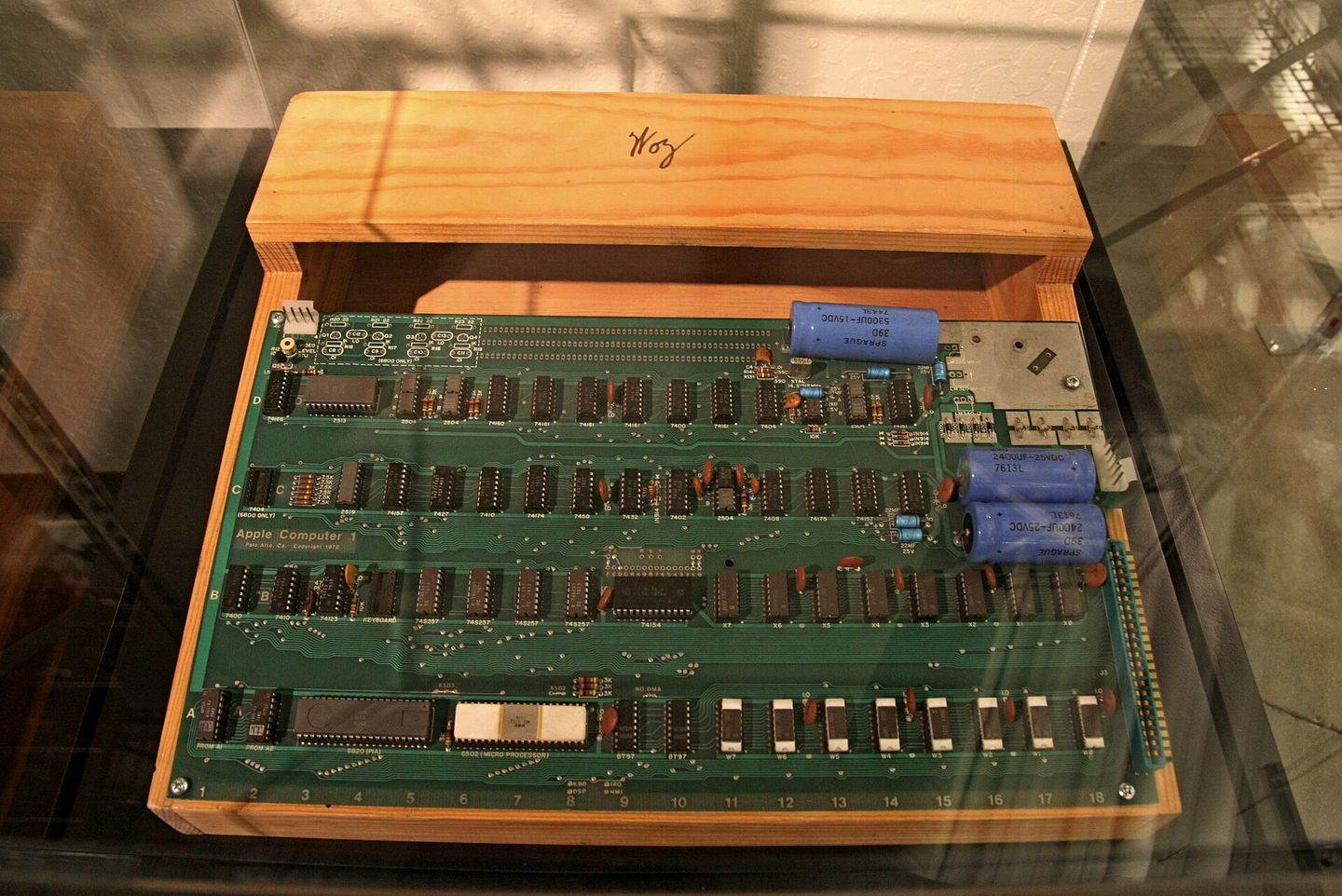 Apple I circuit board and wooden case with Woz sign at the Computer History Museum
