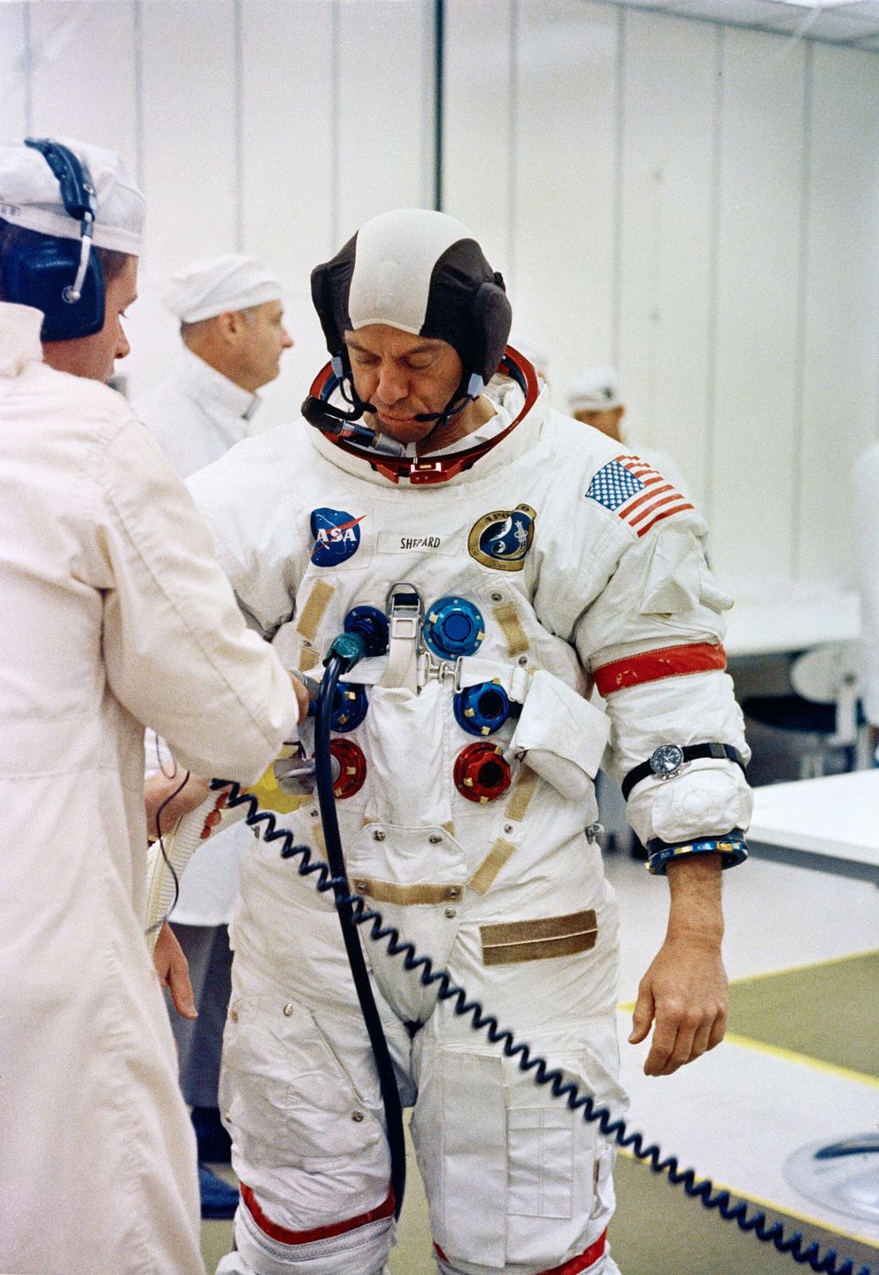 Astronaut Alan B. Shepard Jr., commander of Apollo 14, undergoing suiting up procedures before launch