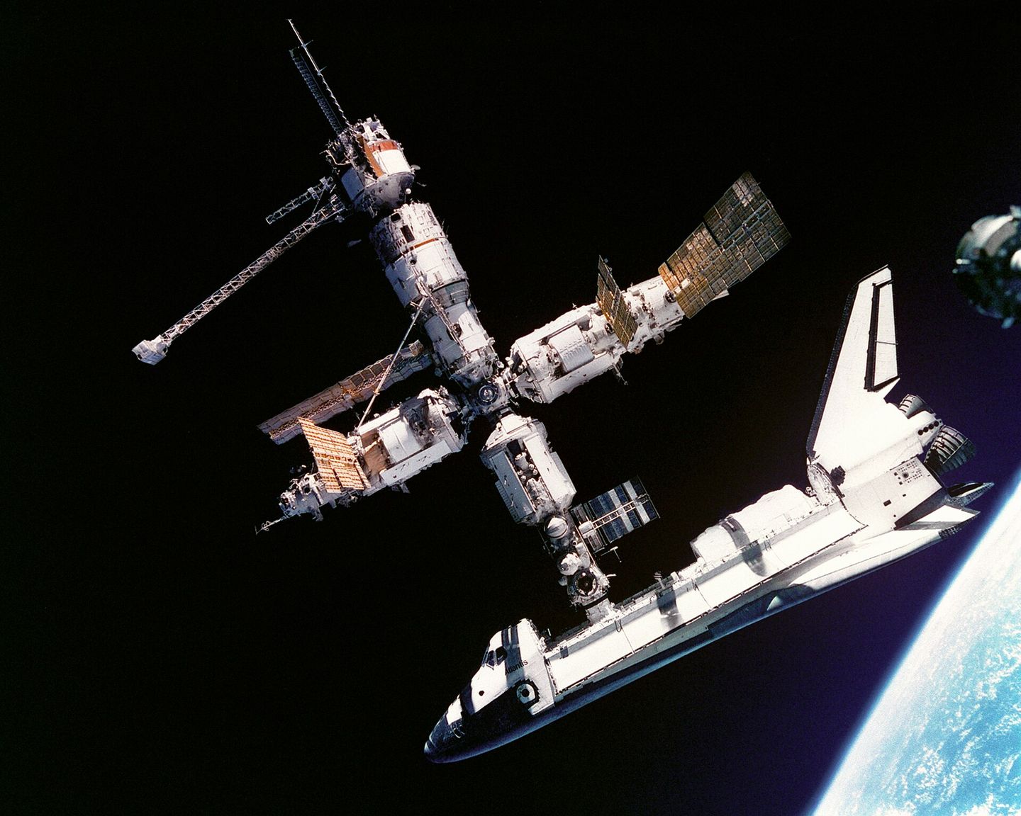 Space Shuttle Atlantis docked to the Russian space station Mir during the STS-71 mission in 1995