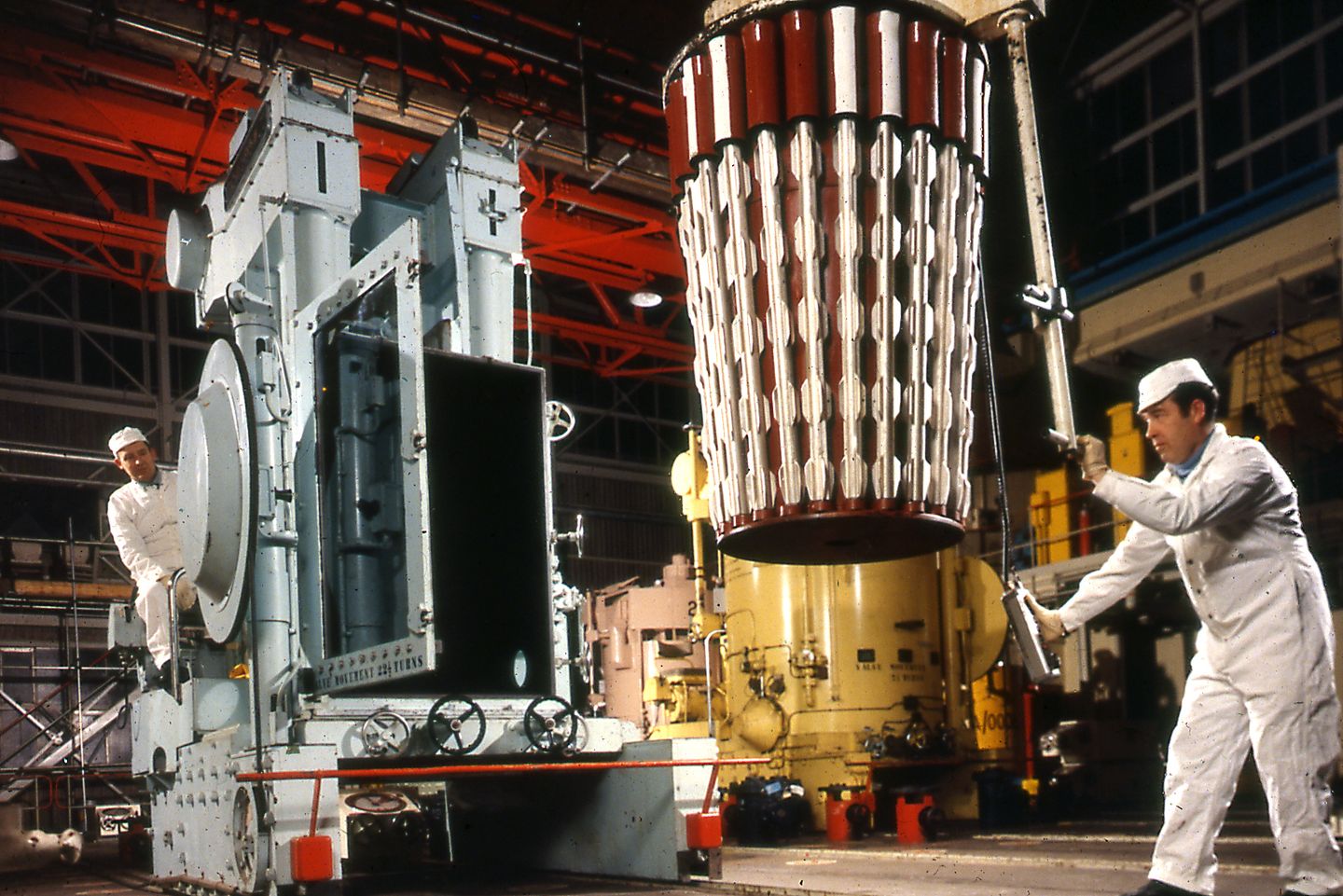 Workers loading fuel into a reactor at Calder Hall nuclear power station