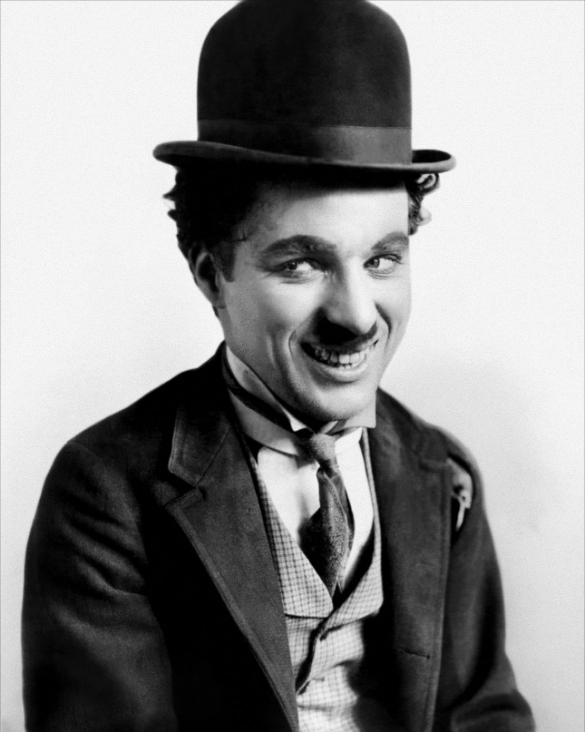 charlie chaplin as the little tramp, his iconic silent film character