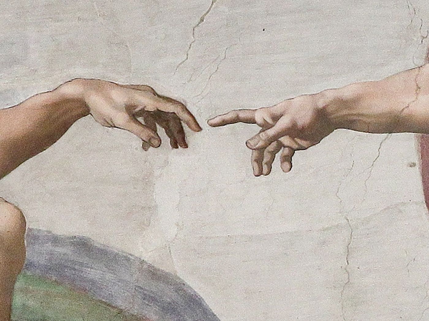 Detail from The Creation of Adam showing the hands of God and Adam nearly touching