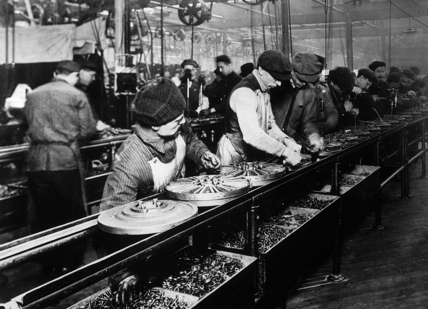 Workers on the Ford assembly line