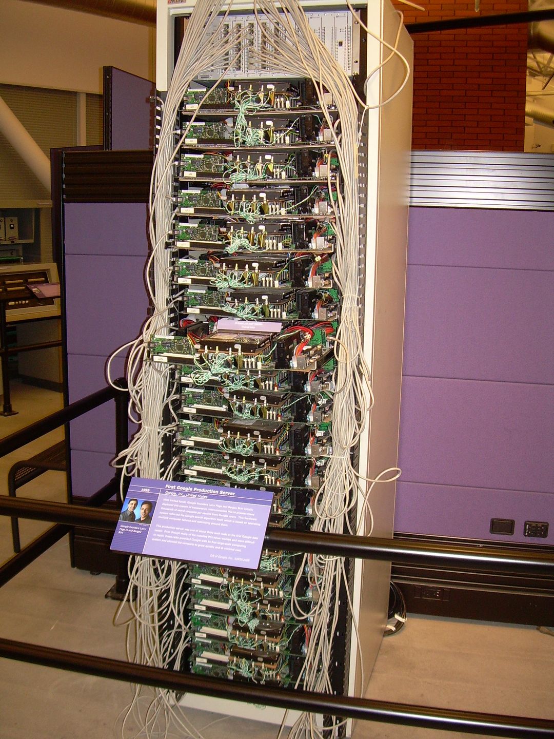 Google's first production server rack from 1999, a cabinet of exposed circuit boards