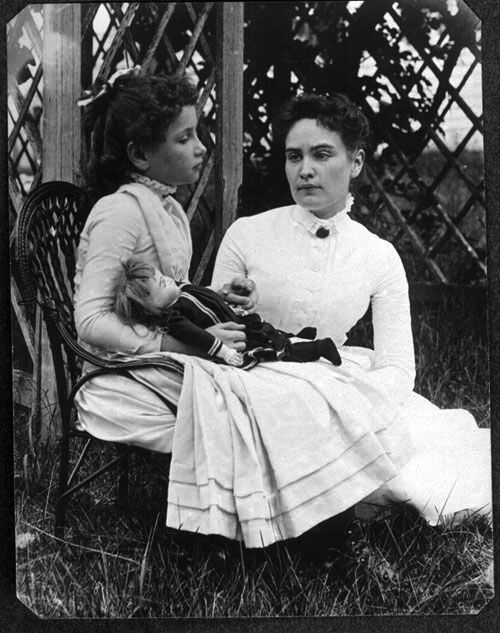 Helen Keller seated with her teacher Anne Sullivan in July 1888, when Keller was eight years old