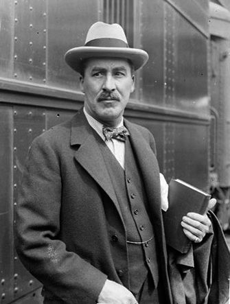 Howard Carter examining the sarcophagus of King Tutankhamun