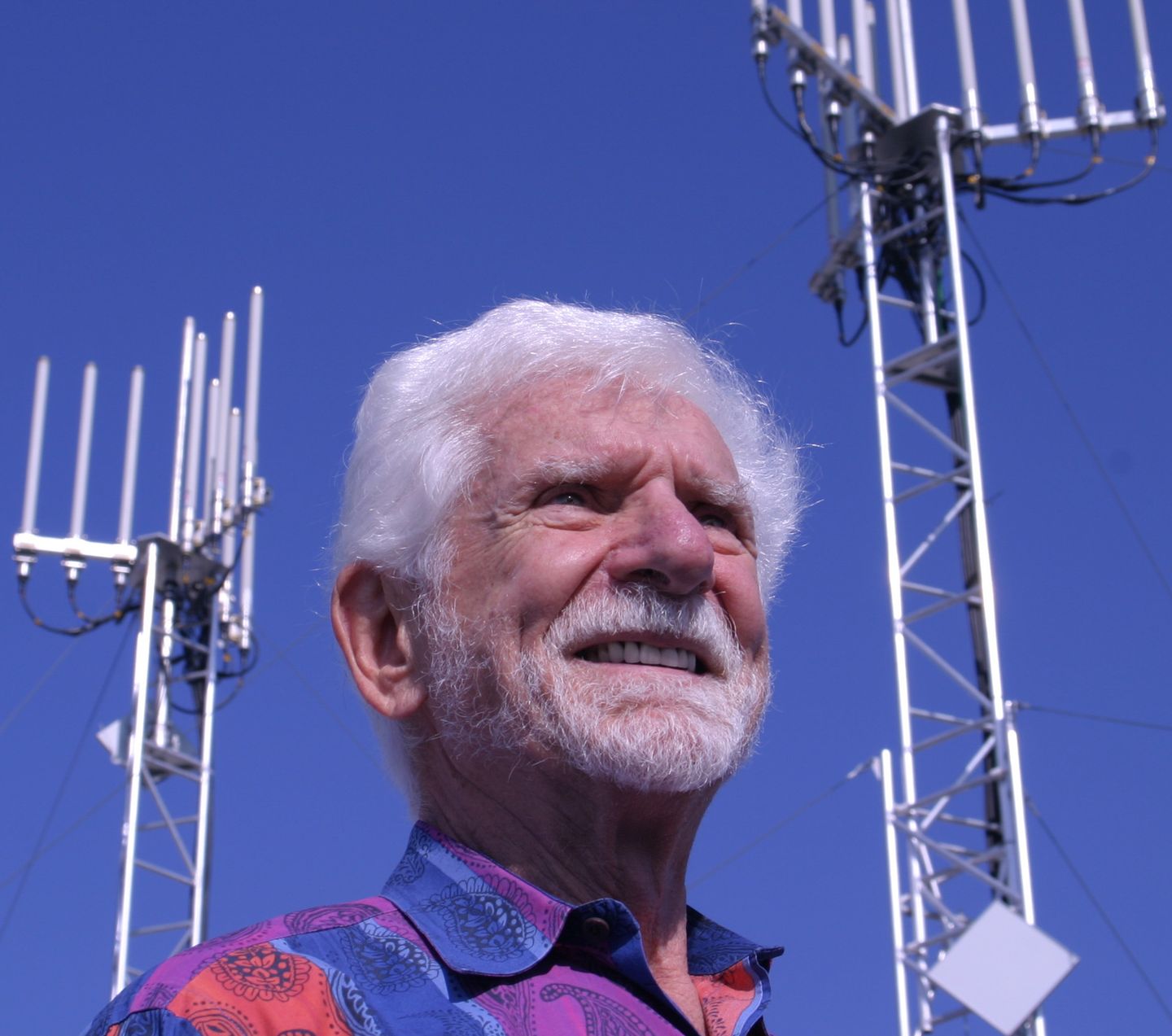 Martin Cooper, inventor of the mobile phone, holding two antennas, October 2010