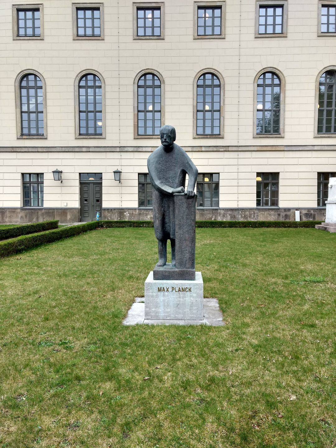 bronze statue of max planck outside humboldt university in berlin