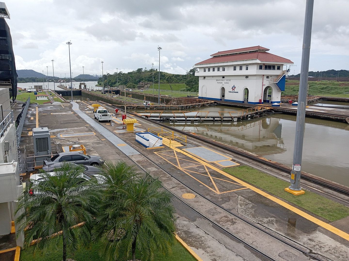 the miraflores locks of the panama canal, showing a ship being raised through the lock chambers