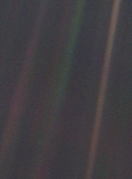 The Pale Blue Dot photograph taken by Voyager 1 on February 14, 1990, showing Earth as a tiny point of light in the vastness of space