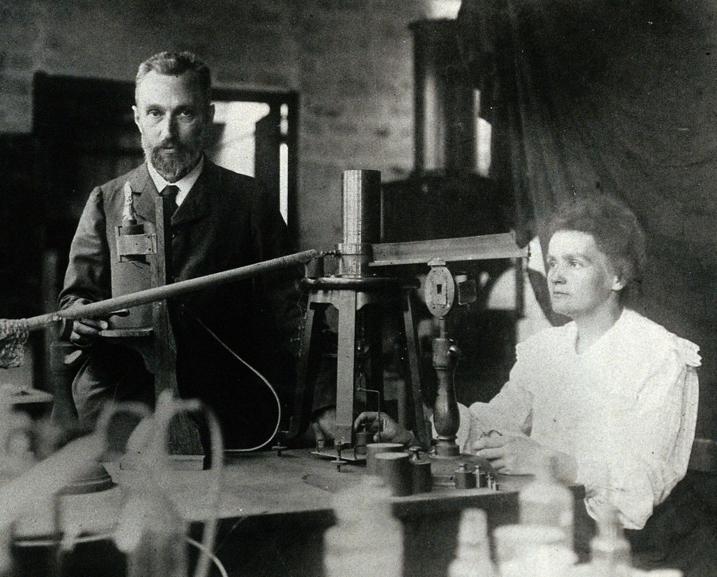 Pierre and Marie Curie photographed together in their laboratory