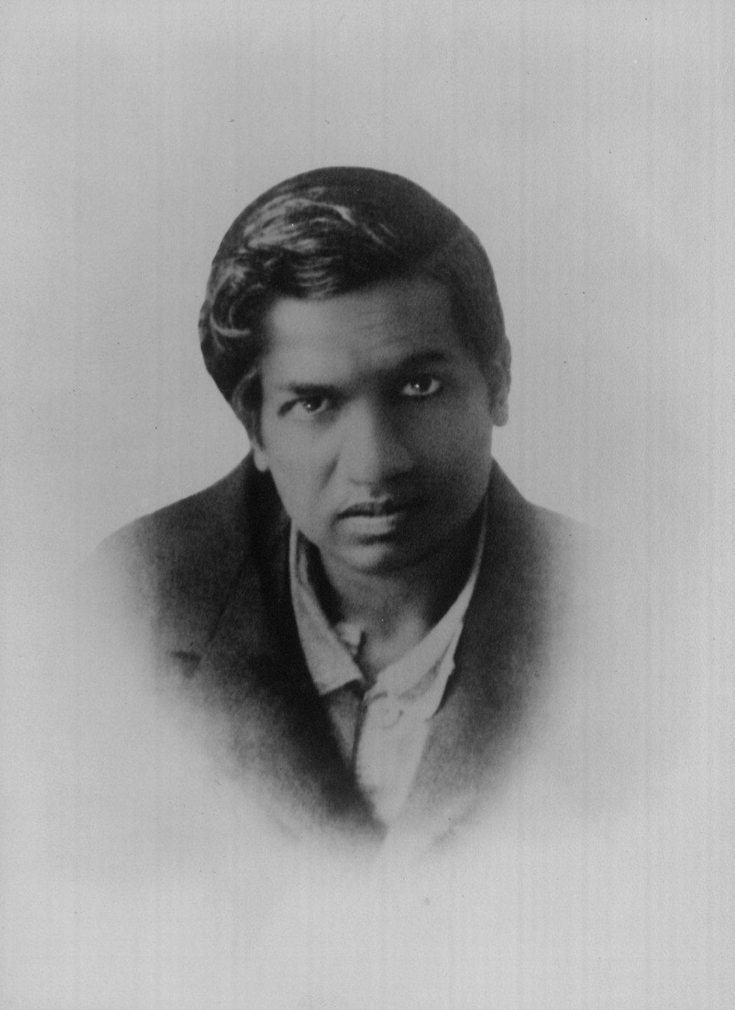 Passport photograph of the mathematician Srinivasa Ramanujan, 1913