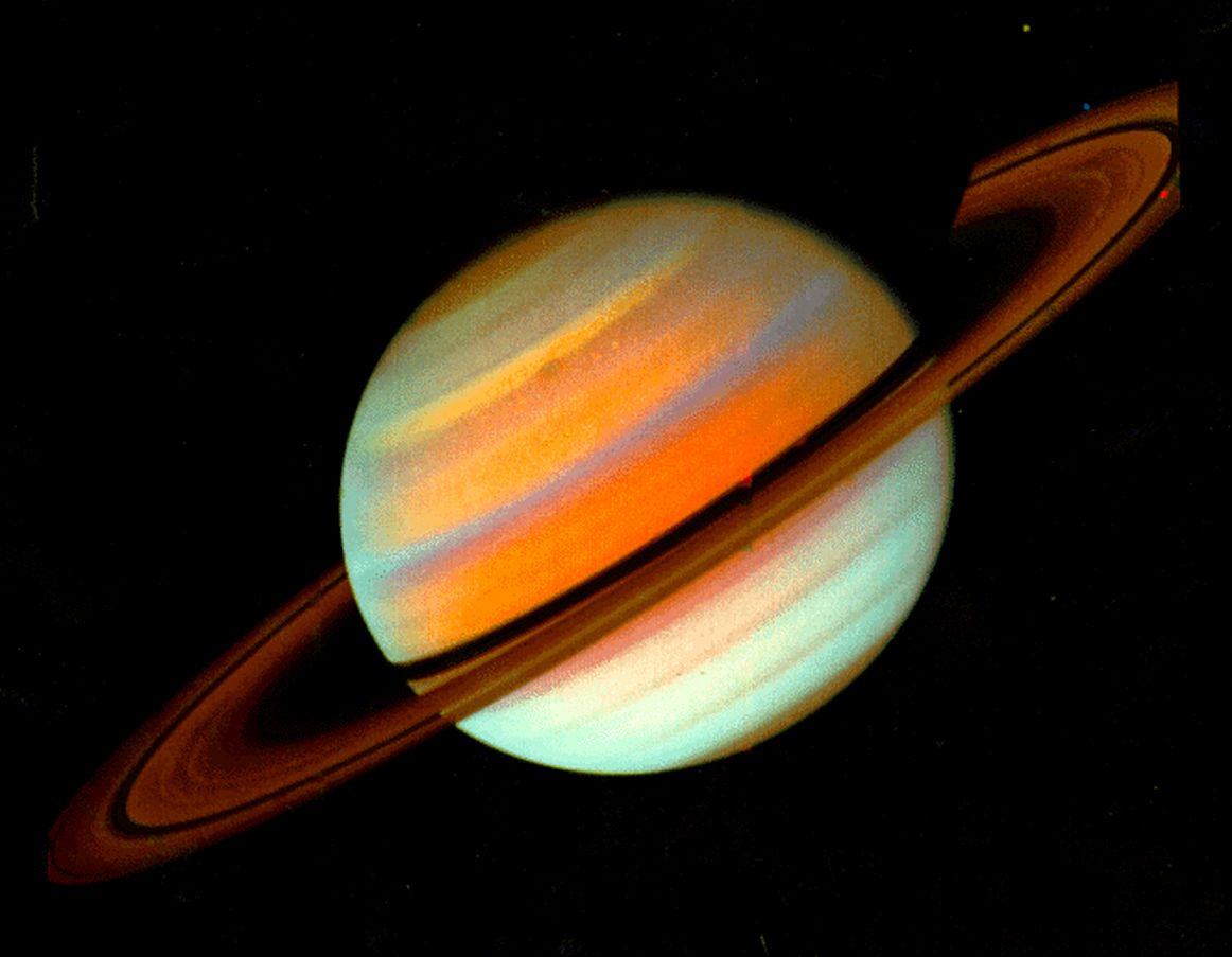 Saturn photographed by Voyager 1 in false color, showing the planet's rings and bands