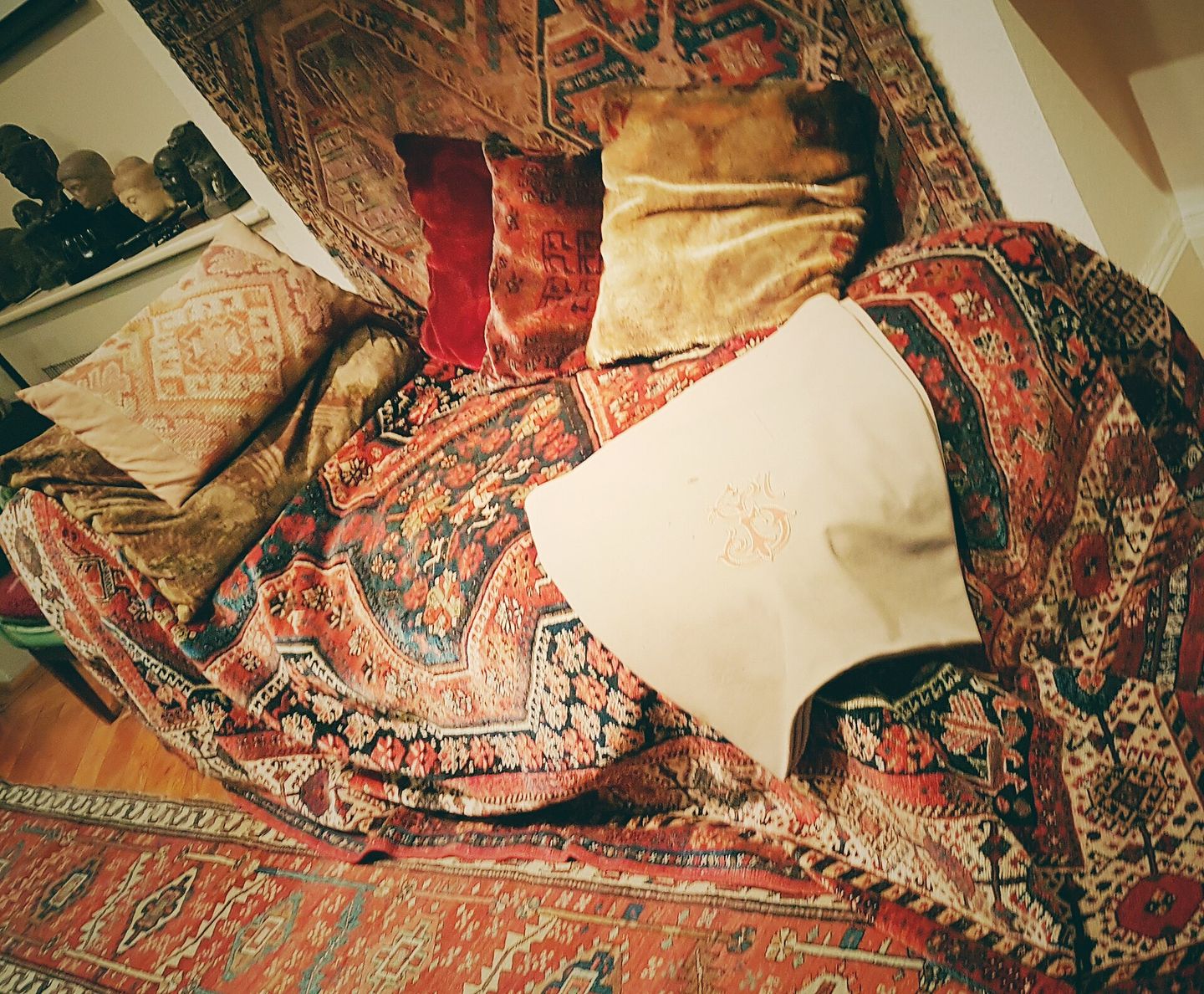 freud's famous psychoanalytic couch in his london consulting room, covered with a persian rug and cushions where patients would undergo free association