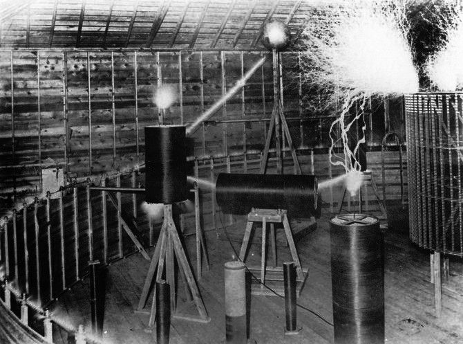 tesla's colorado springs laboratory showing electrical resonance arcing between high-voltage coils, 1899