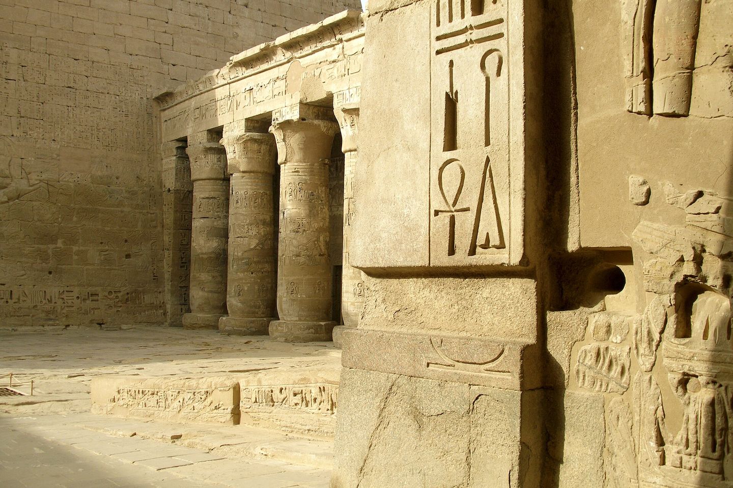 egyptian hieroglyphs carved into the walls of the temple of ramesses iii at medinet habu, thebes