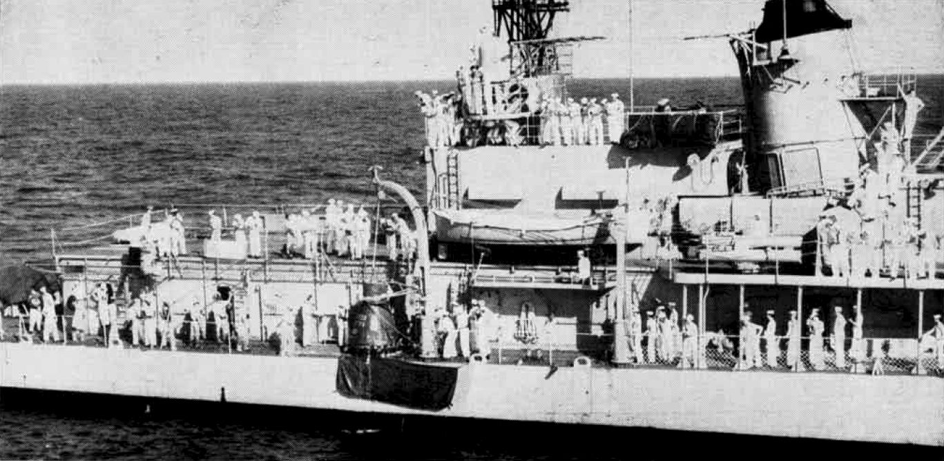 The destroyer USS Noa hoists the Friendship 7 capsule from the Atlantic Ocean after splashdown